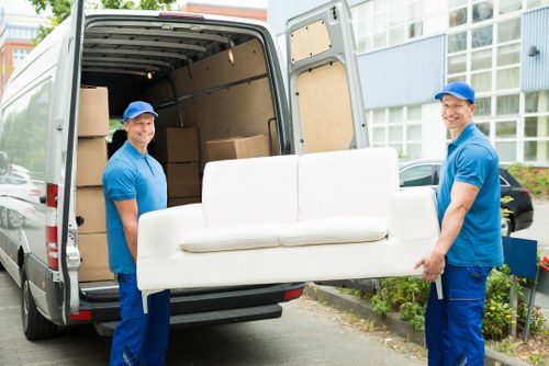 Professional movers from Owen Removalists handling household items