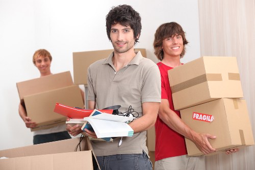 Efficient removalist team unloading belongings at new home