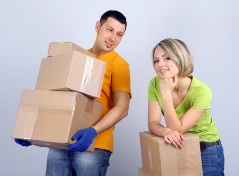 Professional movers handling items in Owen Removalists truck